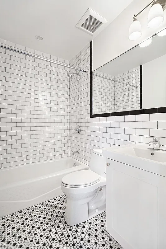 306 7th Street, Unit 1 Brooklyn, NY 11215 - Photo 5 of 9 a bathroom with a sink a toilet and shower