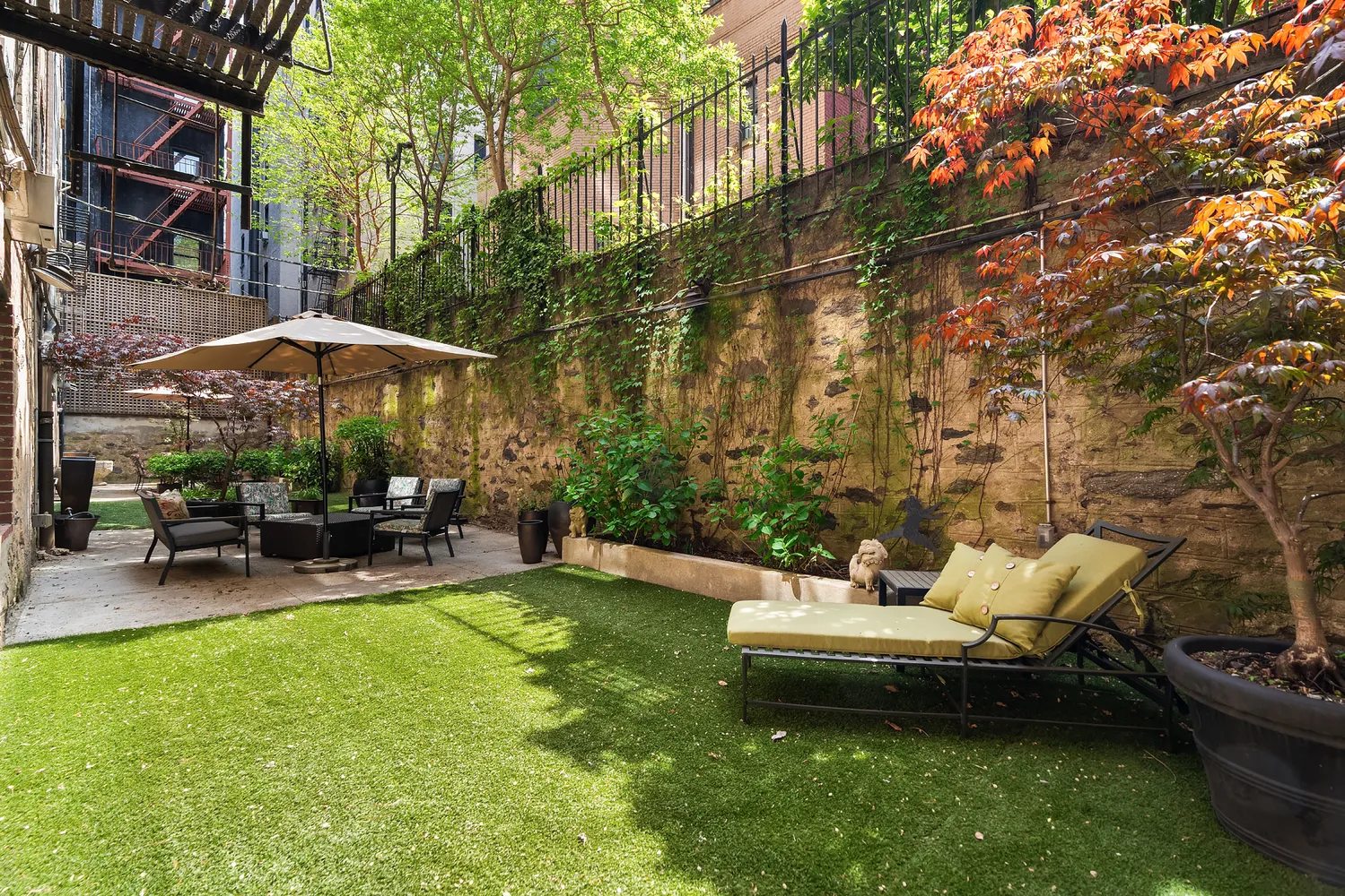 a view of a backyard with sitting area and furniture