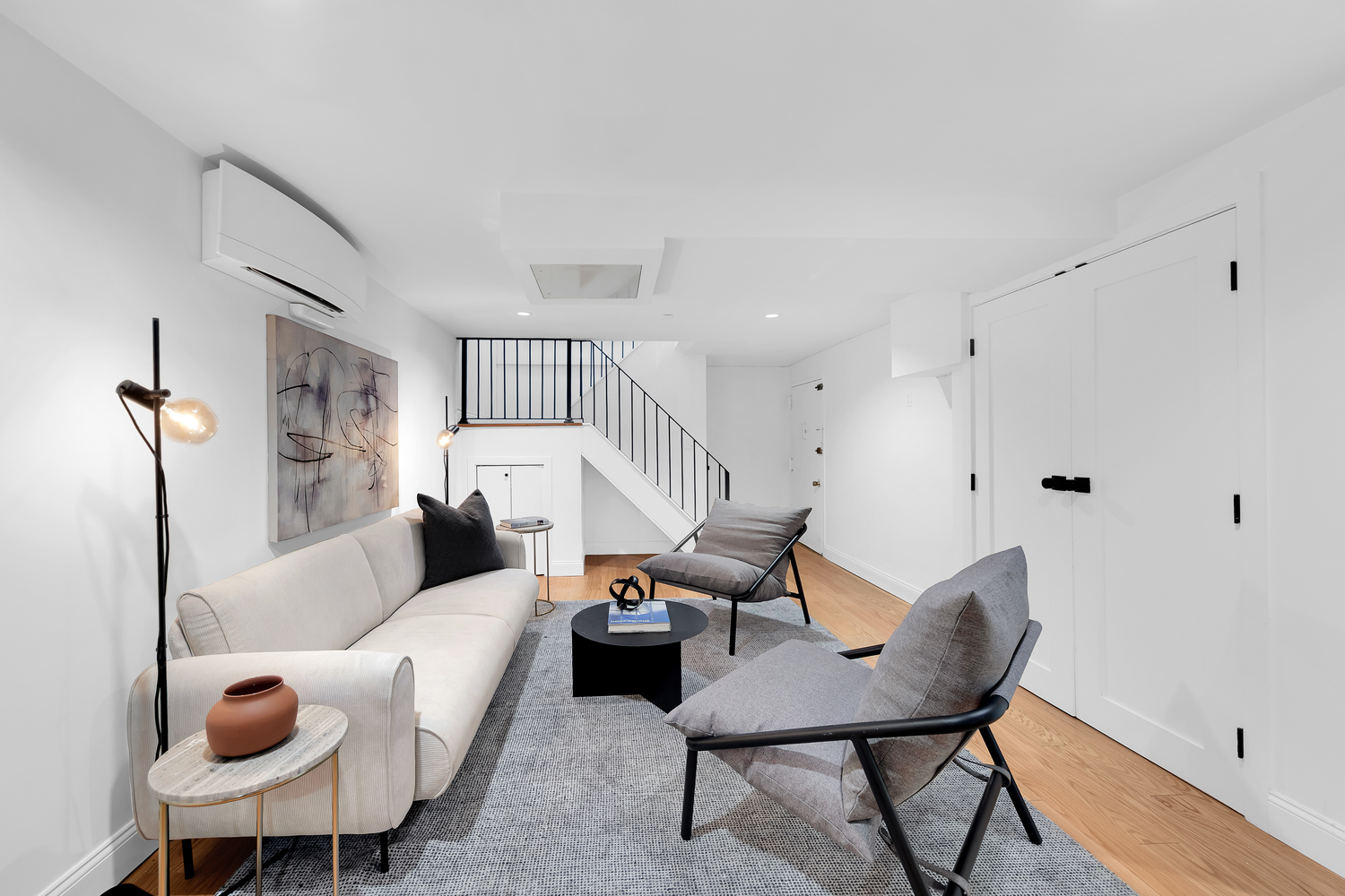 26 South Oxford Street, Unit 1A Brooklyn, NY 11217 - Photo 8 of 13 a living room with furniture and a chandelier