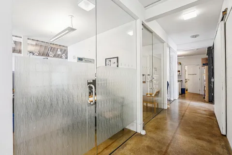 a bathroom with a shower and a mirror