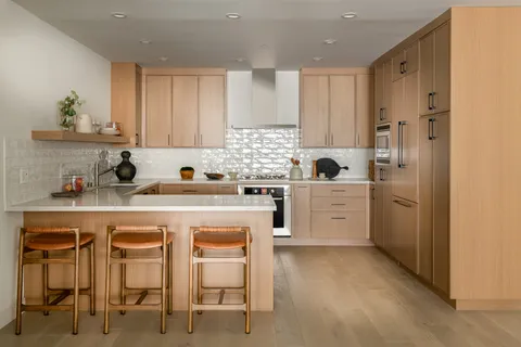 a kitchen with a sink and cabinets