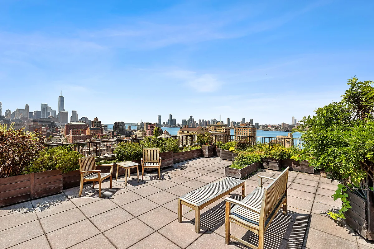 61 Jane Street, Unit 19E Manhattan, NY 10014 - Photo 7 of 9 a view of a terrace with sitting area