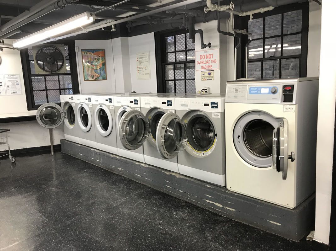 304 East 41st Street, Unit 502A Manhattan, NY 10017 - Photo 5 of 5 a utility room with dryer and washer