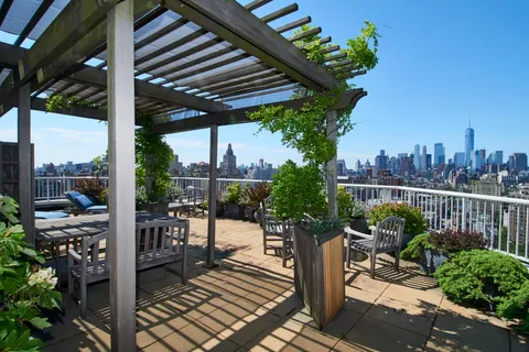 a view of a chair and tables in the patio