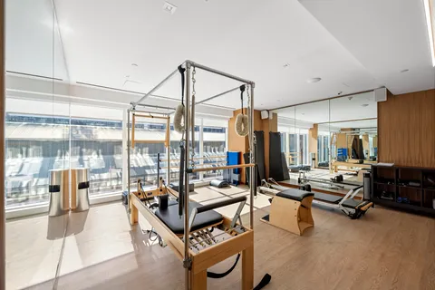 a living room with furniture gym equipment