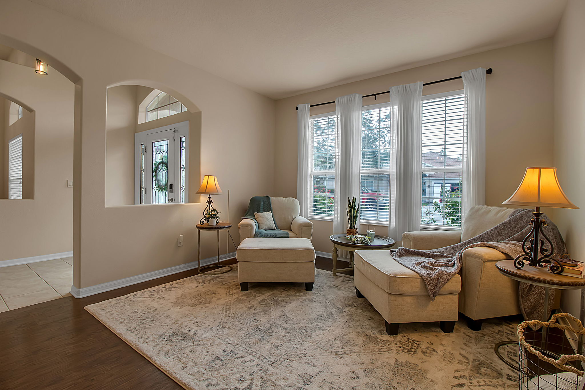 6106 34th Court East Bradenton, FL 34203 - Photo 18 of 69 a living room with furniture and a floor to ceiling window