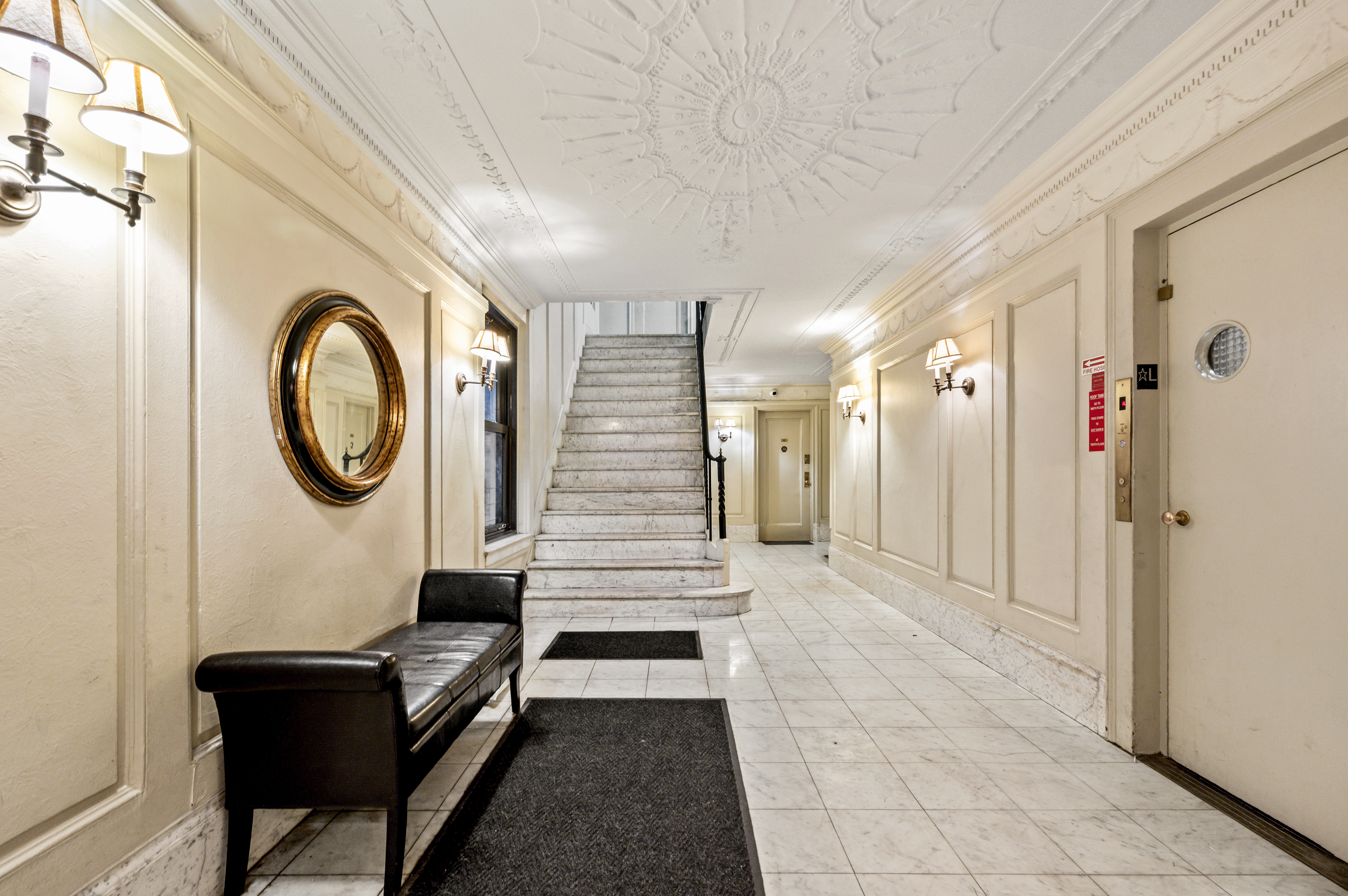 17 West 64th Street, Unit 6E Manhattan, NY 10023 - Photo 5 of 6 a view of a hallway with washer and dryer