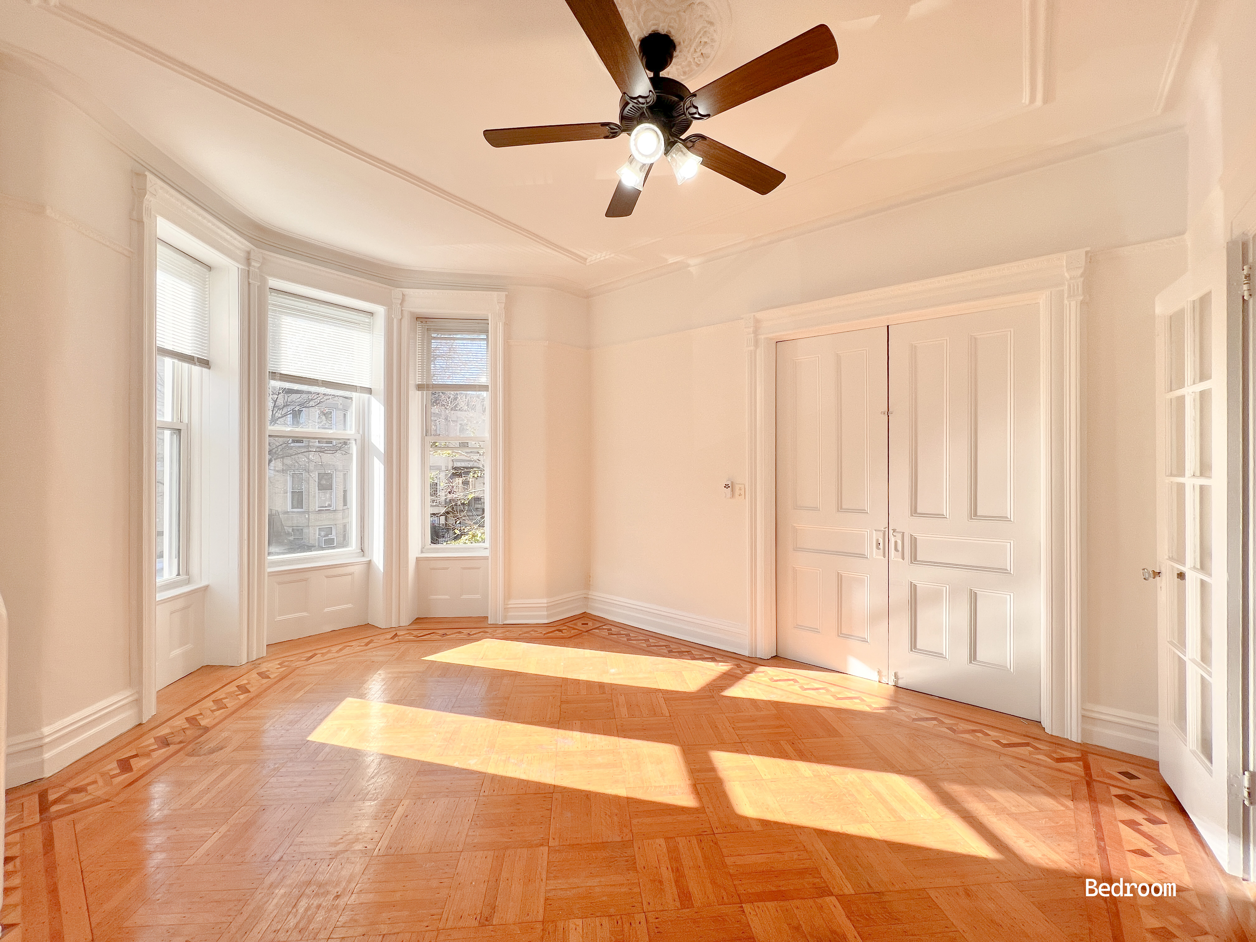 271 71st Street, Unit 2 Brooklyn, NY 11209 - Photo 2 of 10 a view of a livingroom with a ceiling fan and window