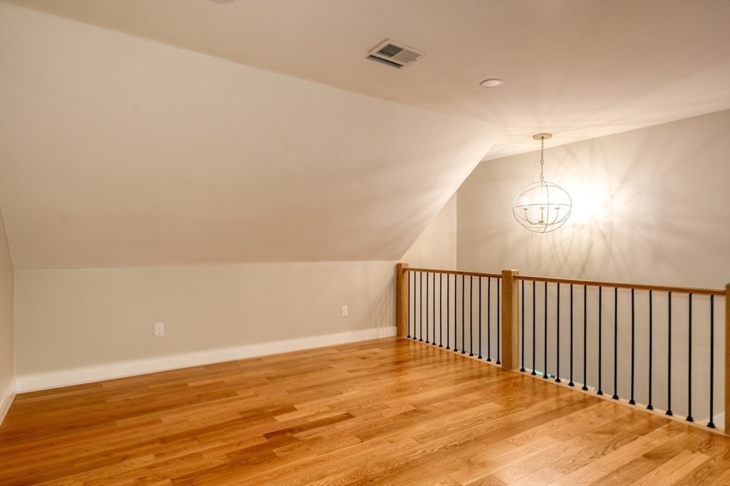 171 Randall Road Berlin, MA 01503 - Photo 20 of 41 a view of a room with wooden floor and a ceiling fan