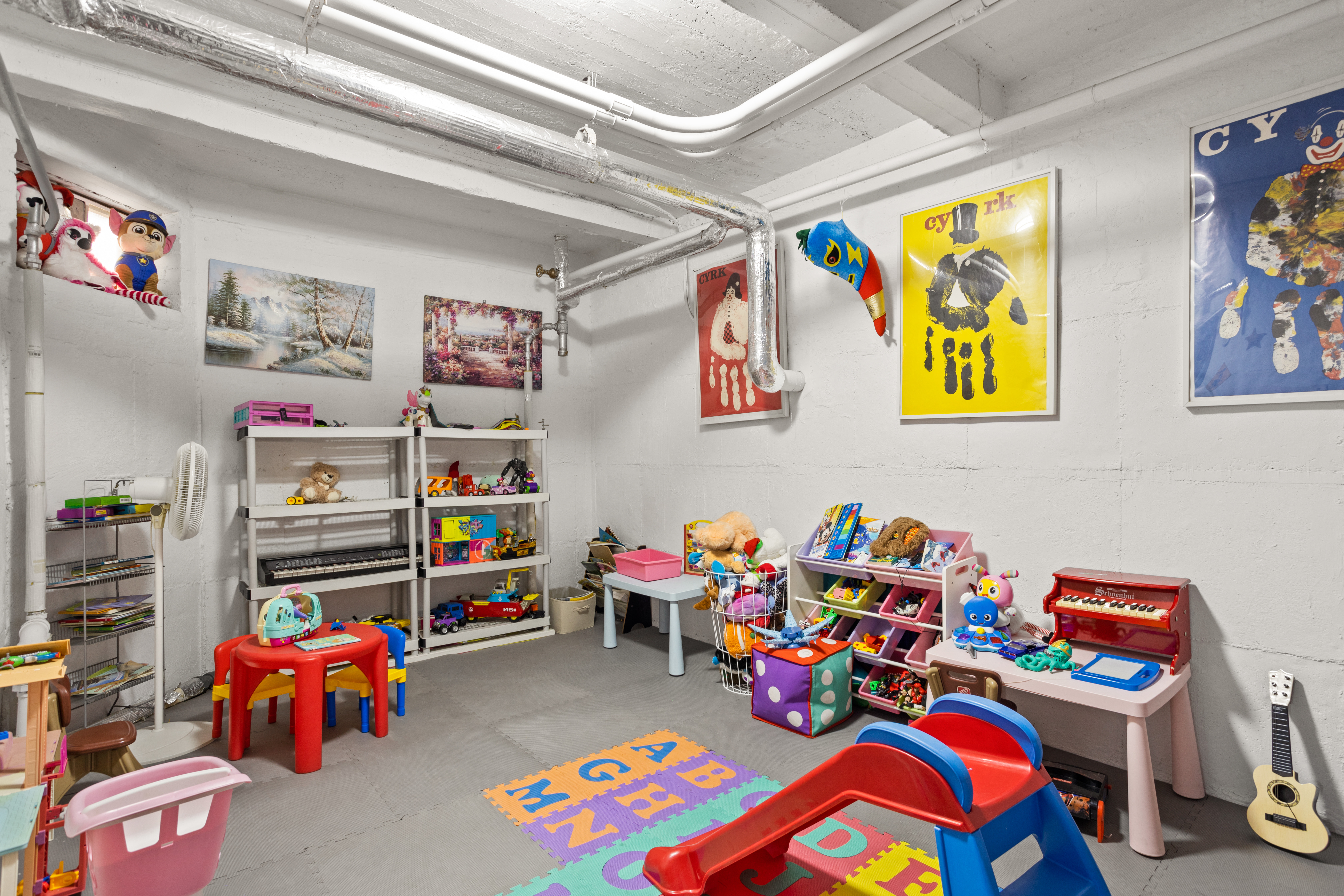 61-41 Saunders Street, Unit A18 Queens, NY 11374 - Photo 8 of 11 a play room with toys and a couch