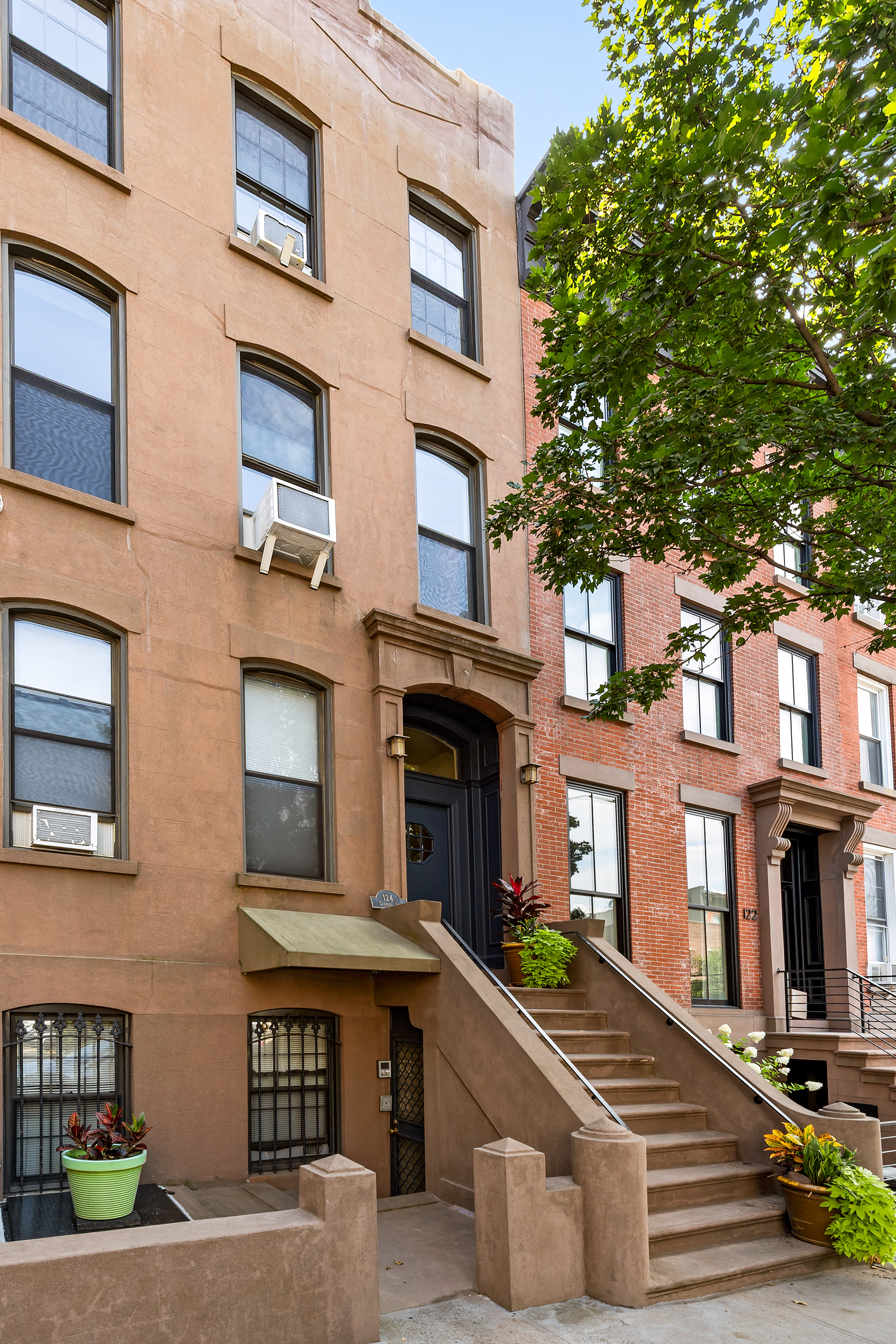 124 Carroll Street, Unit 2 Brooklyn, NY 11231 - Photo 12 of 13 a front view of a brick building with many windows