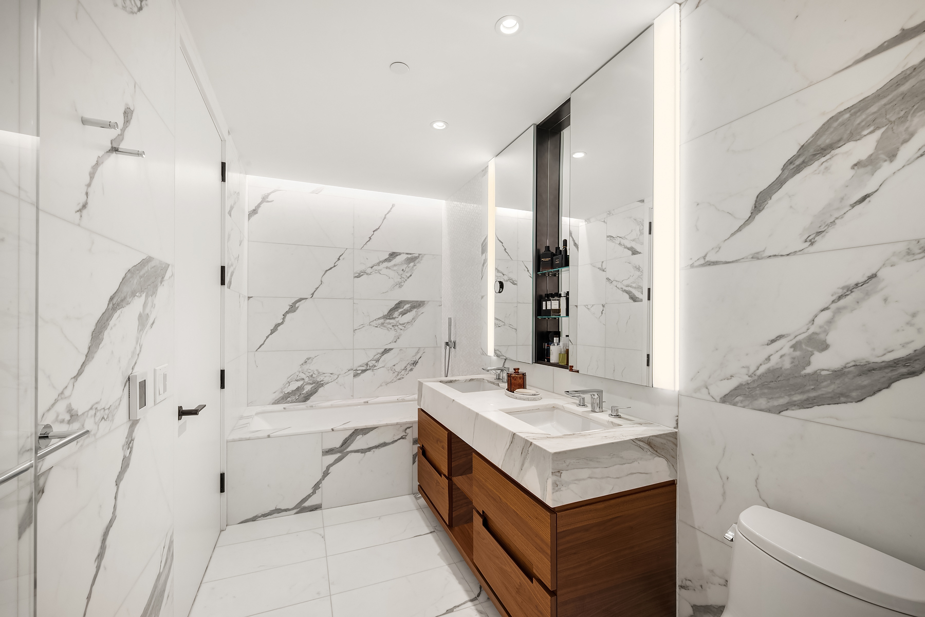 30 Riverside Boulevard, Unit 32E Manhattan, NY 10069 - Photo 7 of 19 a bathroom with a sink a toilet and shower