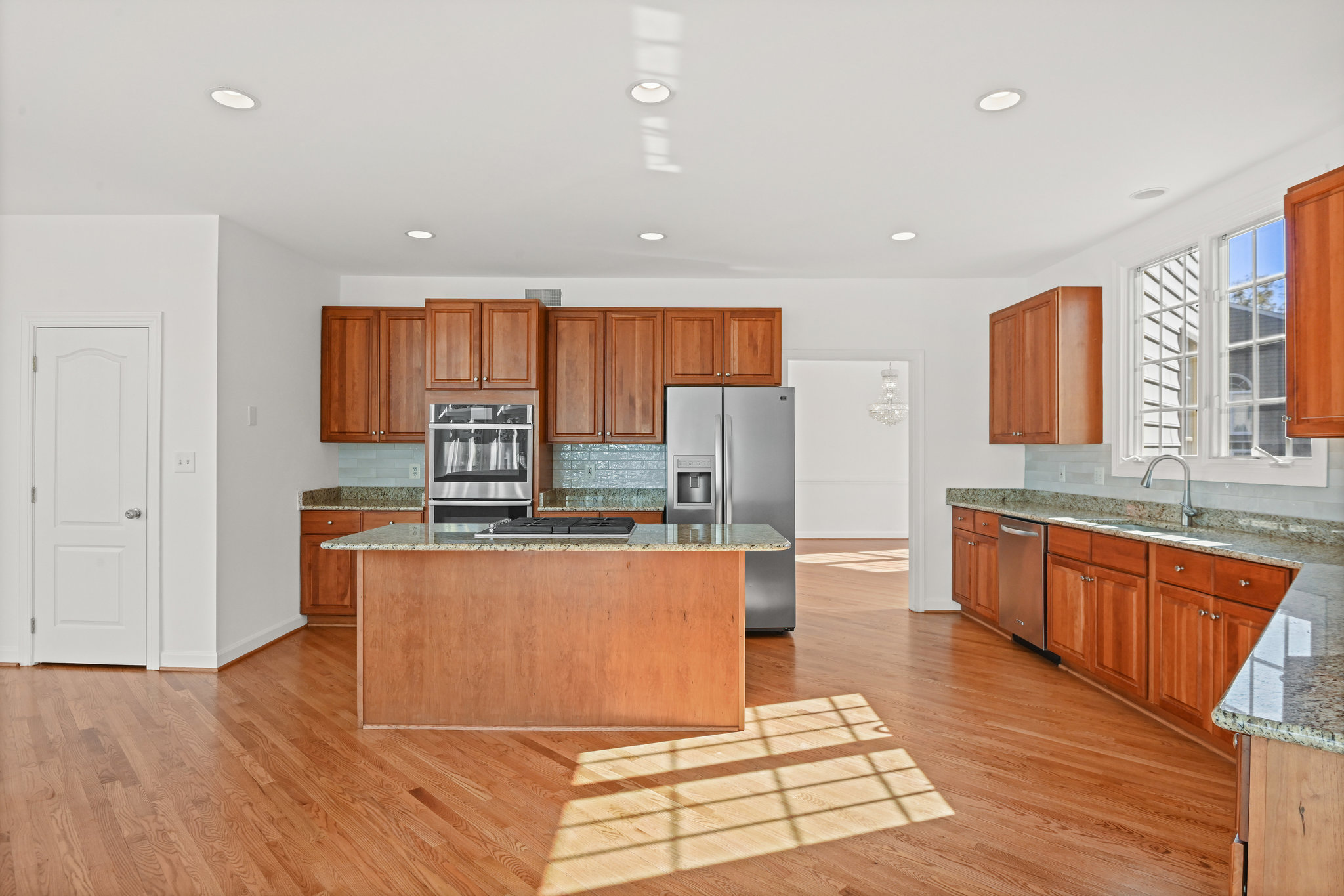 2628 Five Oaks Road Vienna, VA 22181 - Photo 12 of 40 a large kitchen with stainless steel appliances granite countertop a large counter top and a stove top oven