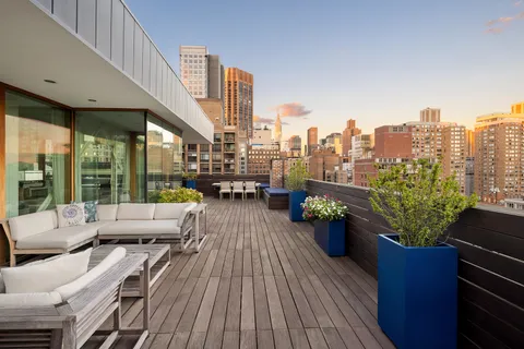 a view of roof deck with patio