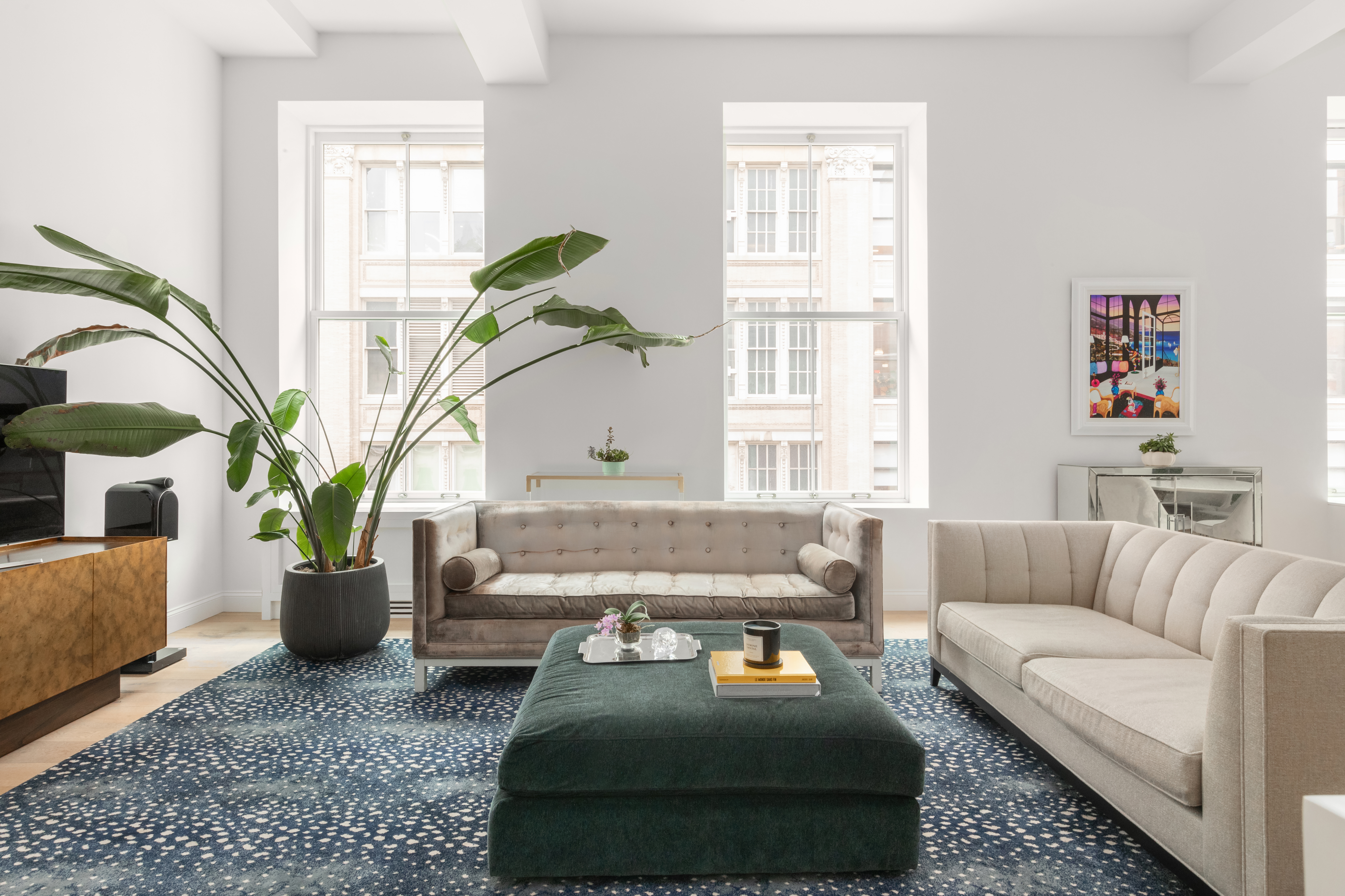 655 6th Avenue, Unit 5H Manhattan, NY 10010 - Photo 2 of 15 a living room with furniture and wooden floor