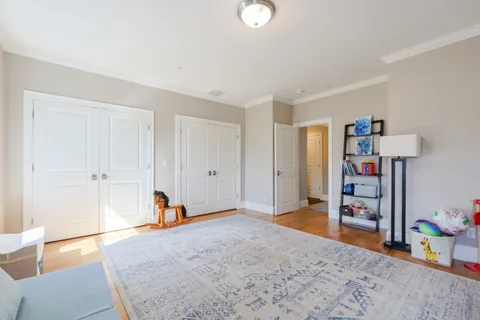 a bedroom with furniture and a window