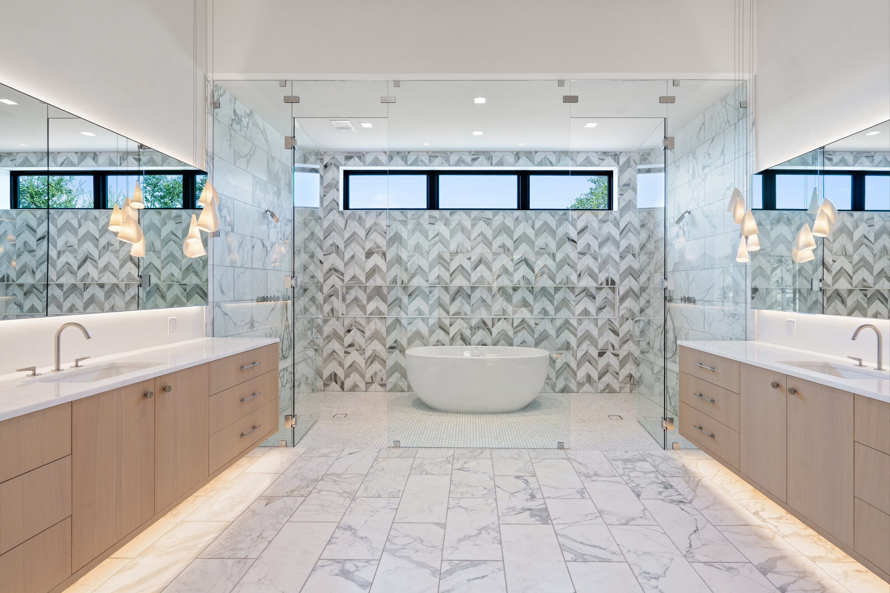 1905 Hallam Drive Austin, TX 78746 - Photo 21 of 39 a spacious bathroom with a double vanity sink a mirror and a bathtub