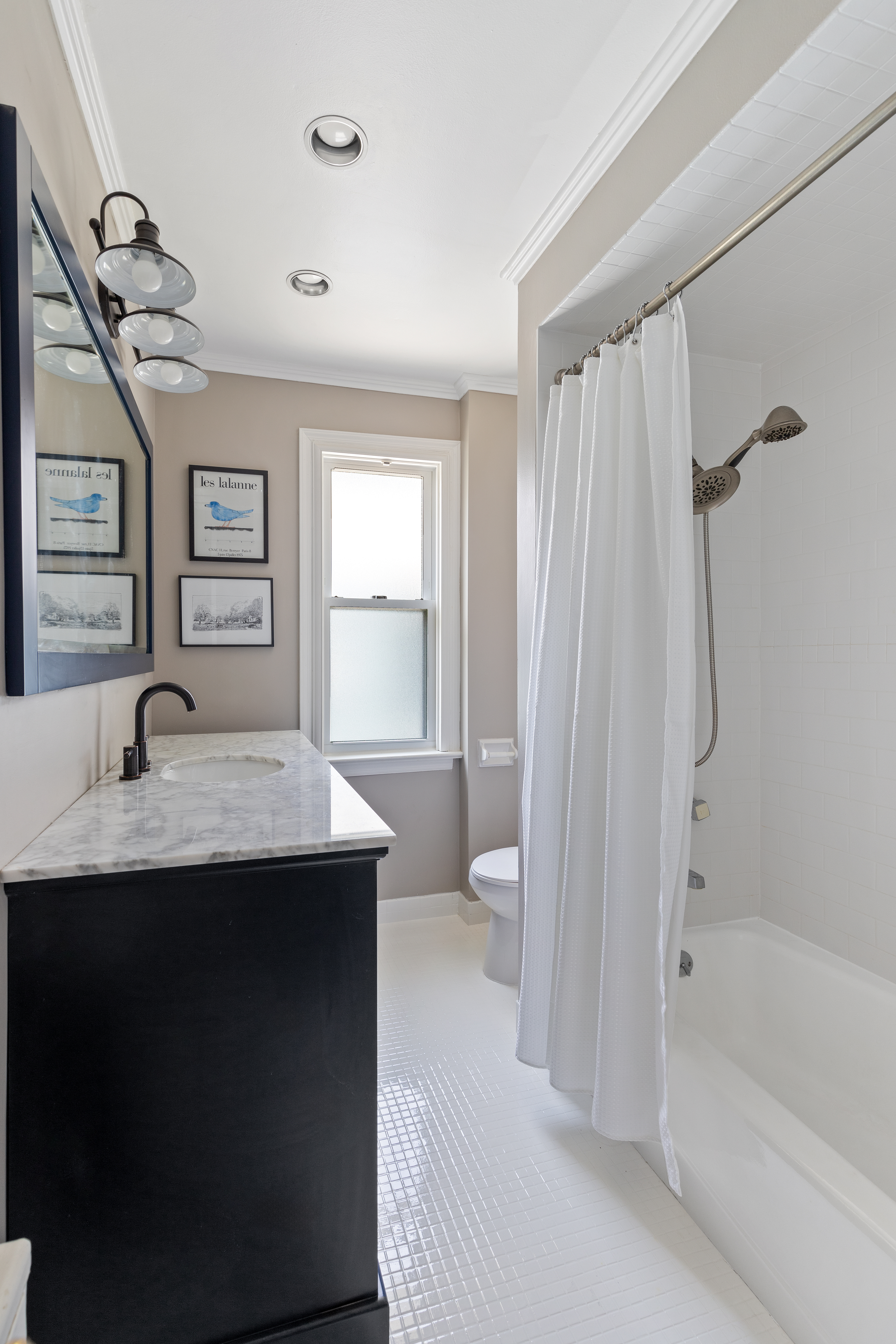 498 Westminster Road Brooklyn, NY 11218 - Photo 22 of 32 a bathroom with a granite countertop sink a toilet and shower