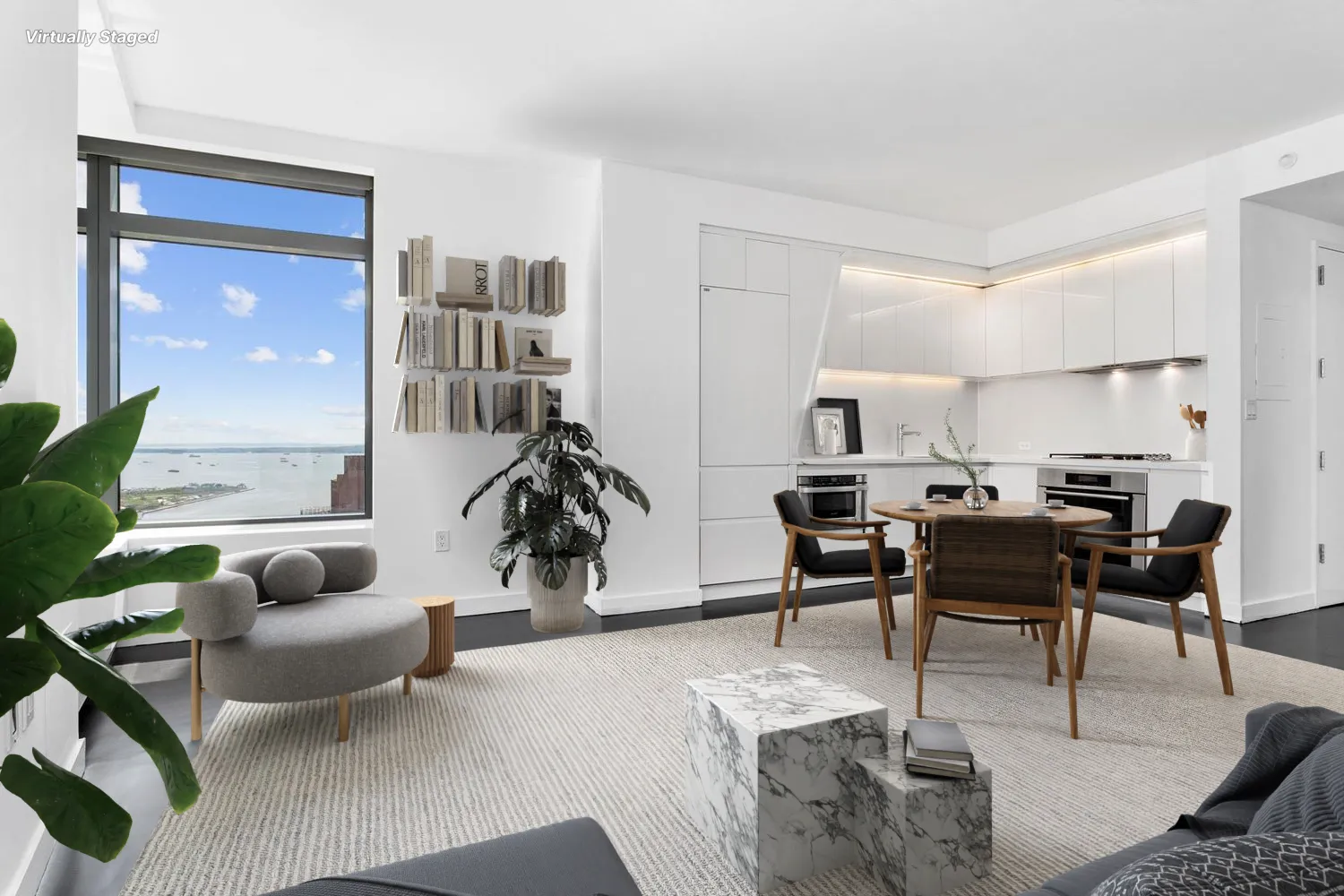 a living room with furniture and view of kitchen
