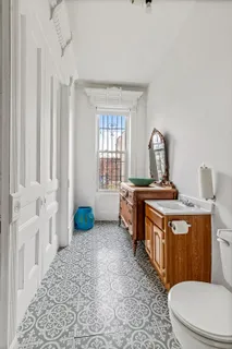 a bathroom with a toilet a sink and a bathtub