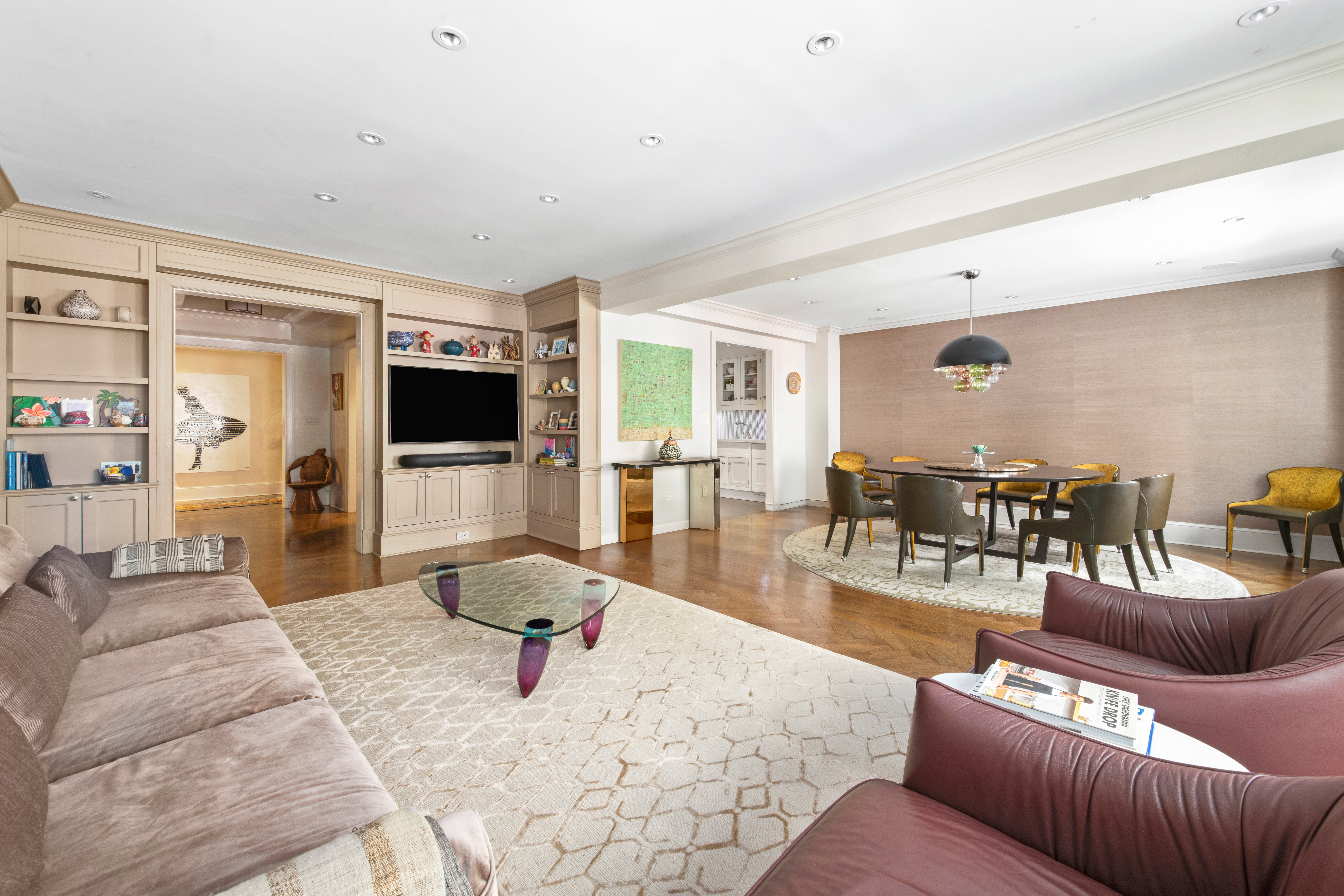 530 Park Avenue, Unit 3F Manhattan, NY 10065 - Photo 2 of 25 a living room with furniture and a flat screen tv