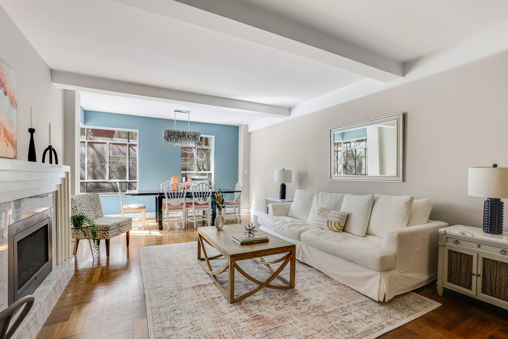 565 West End Avenue, Unit 3C Manhattan, NY 10024 - Photo 3 of 15 a living room with furniture and a fireplace