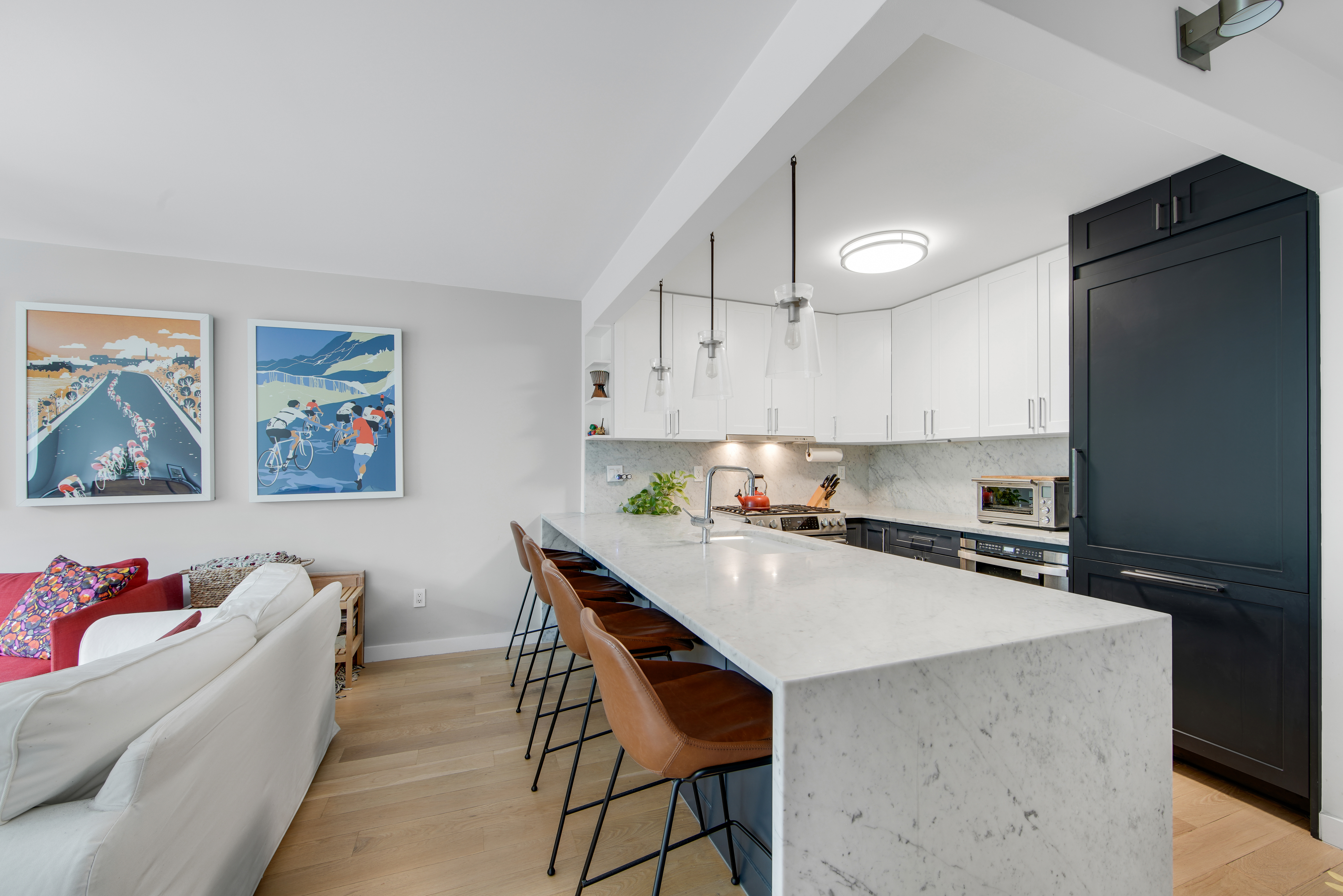 1330 5th Avenue, Unit 3F Manhattan, NY 10026 - Photo 4 of 16 a kitchen with a stove a refrigerator and a dining table