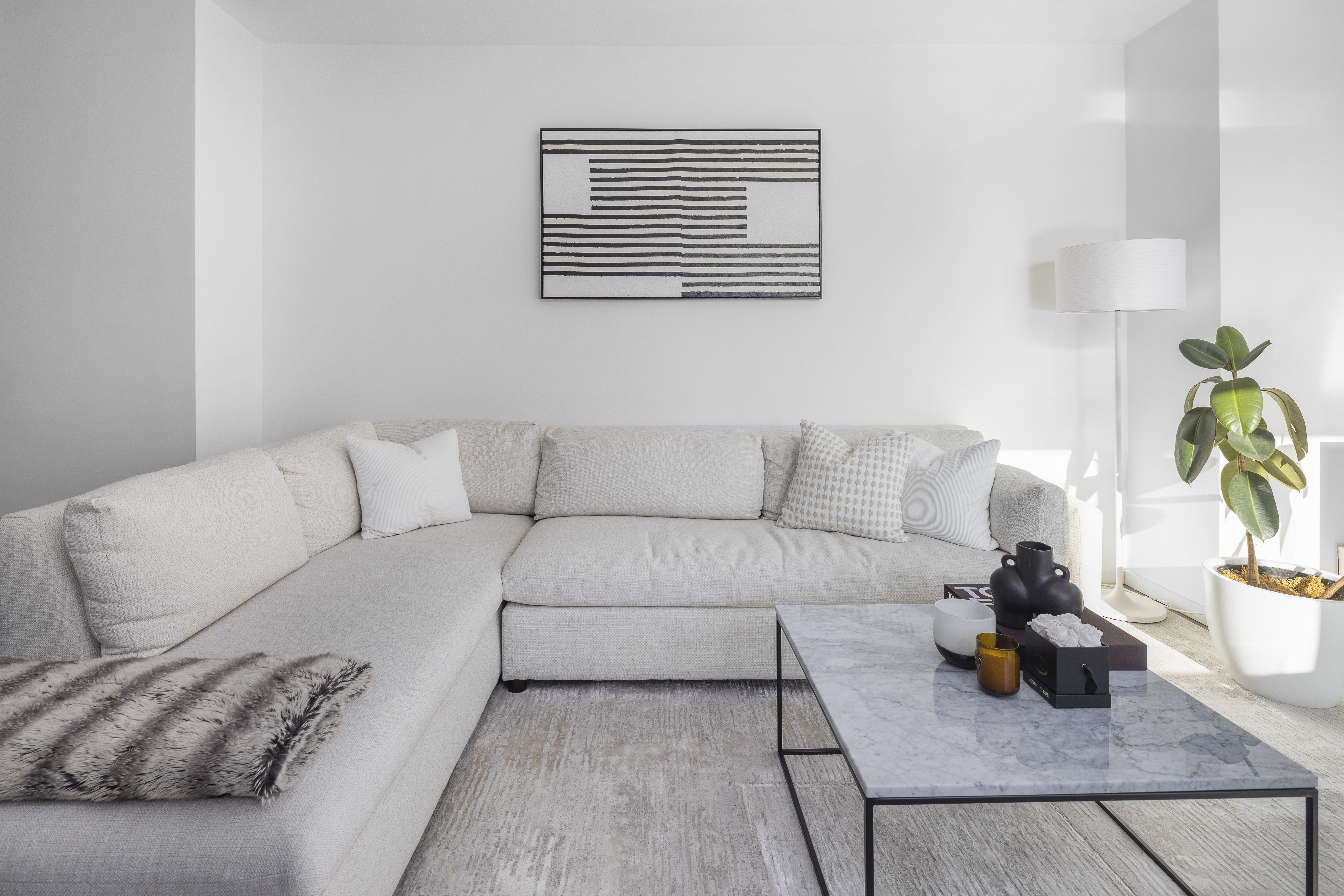 385 1st Avenue, Unit 10G Manhattan, NY 10010 - Photo 6 of 22 a living room with furniture and a couch