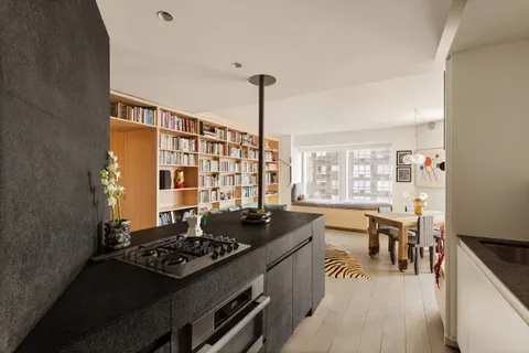 a kitchen with a stove and a wooden floor