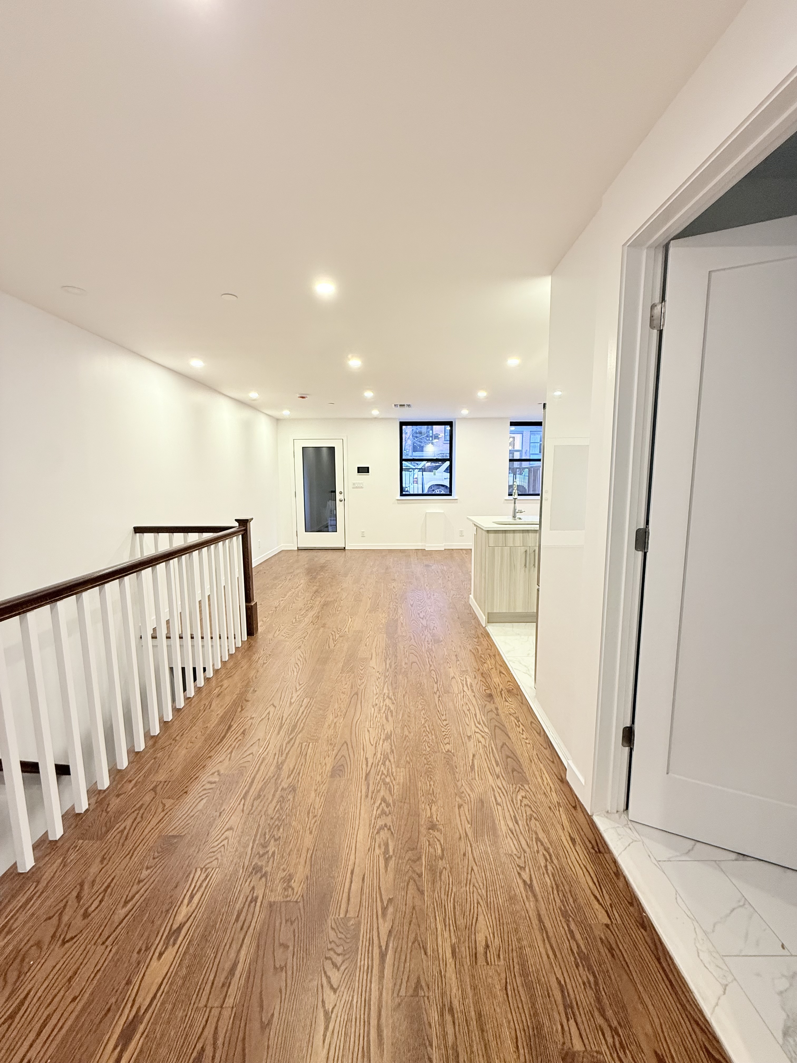 109 President Street, Unit 1 Brooklyn, NY 11231 - Photo 6 of 16 a view of a hallway with wooden floor and staircase