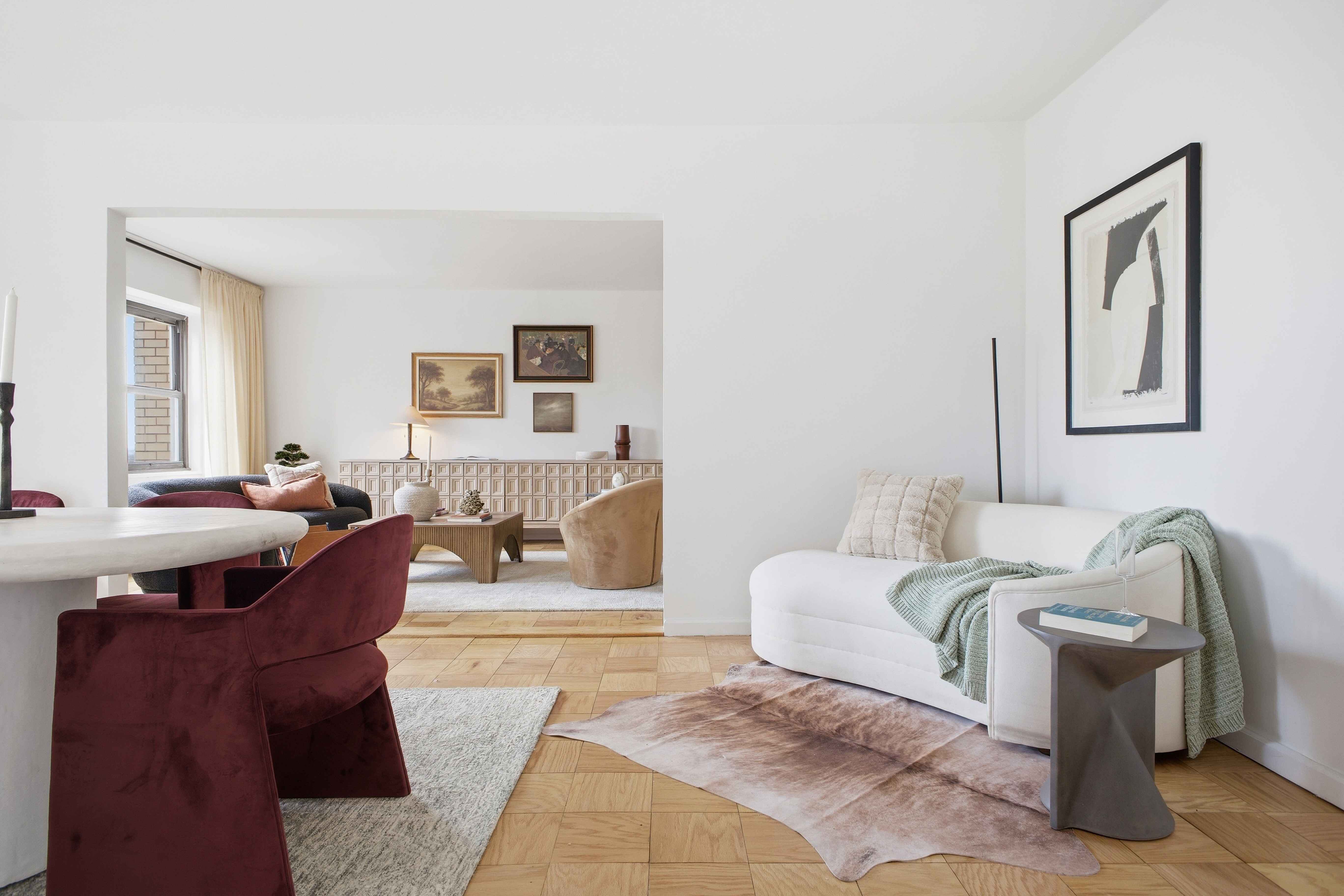160 East 38th Street, Unit 26FG Manhattan, NY 10016 - Photo 5 of 23 a living room with furniture and a mirror