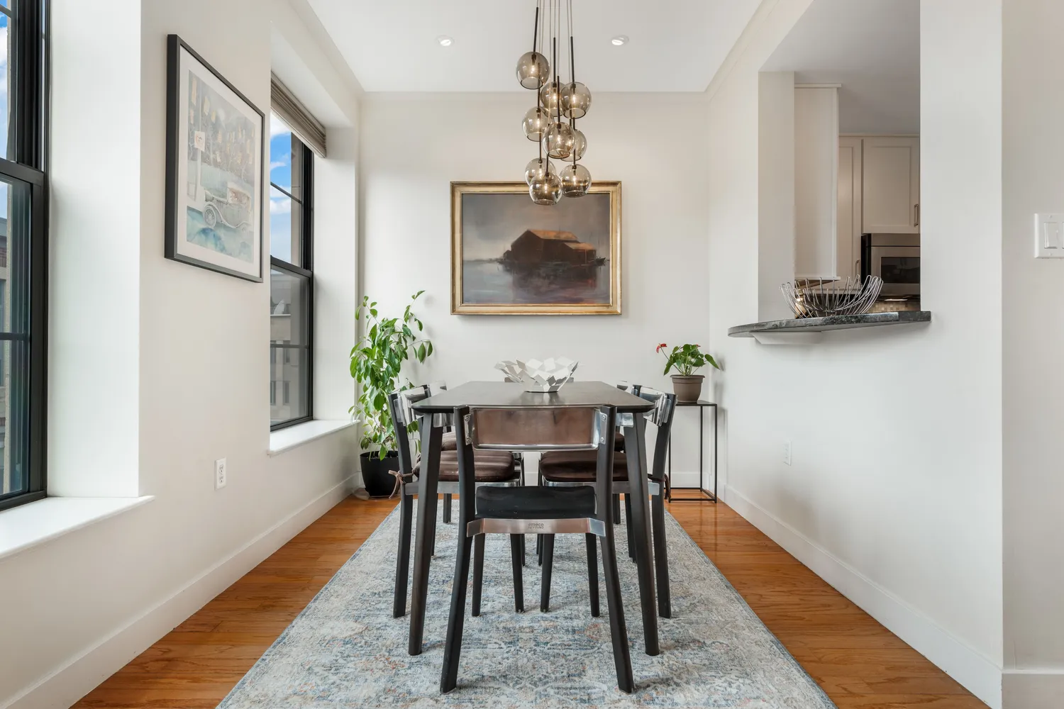 a view of a dining room with furniture and wooden floor