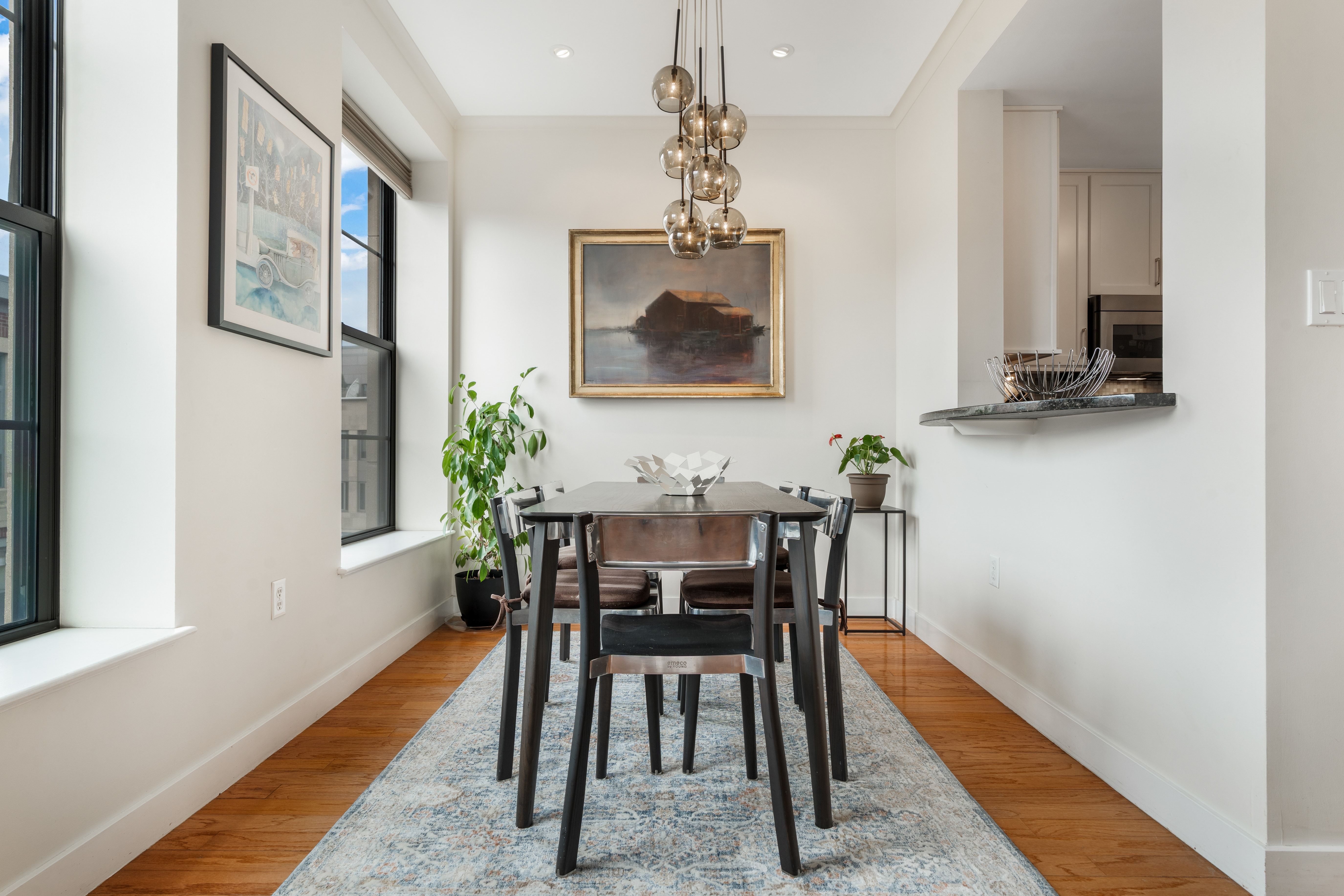 2 Rollins Street, Unit D601 Boston, MA 02118 - Photo 9 of 29 a view of a dining room with furniture and wooden floor