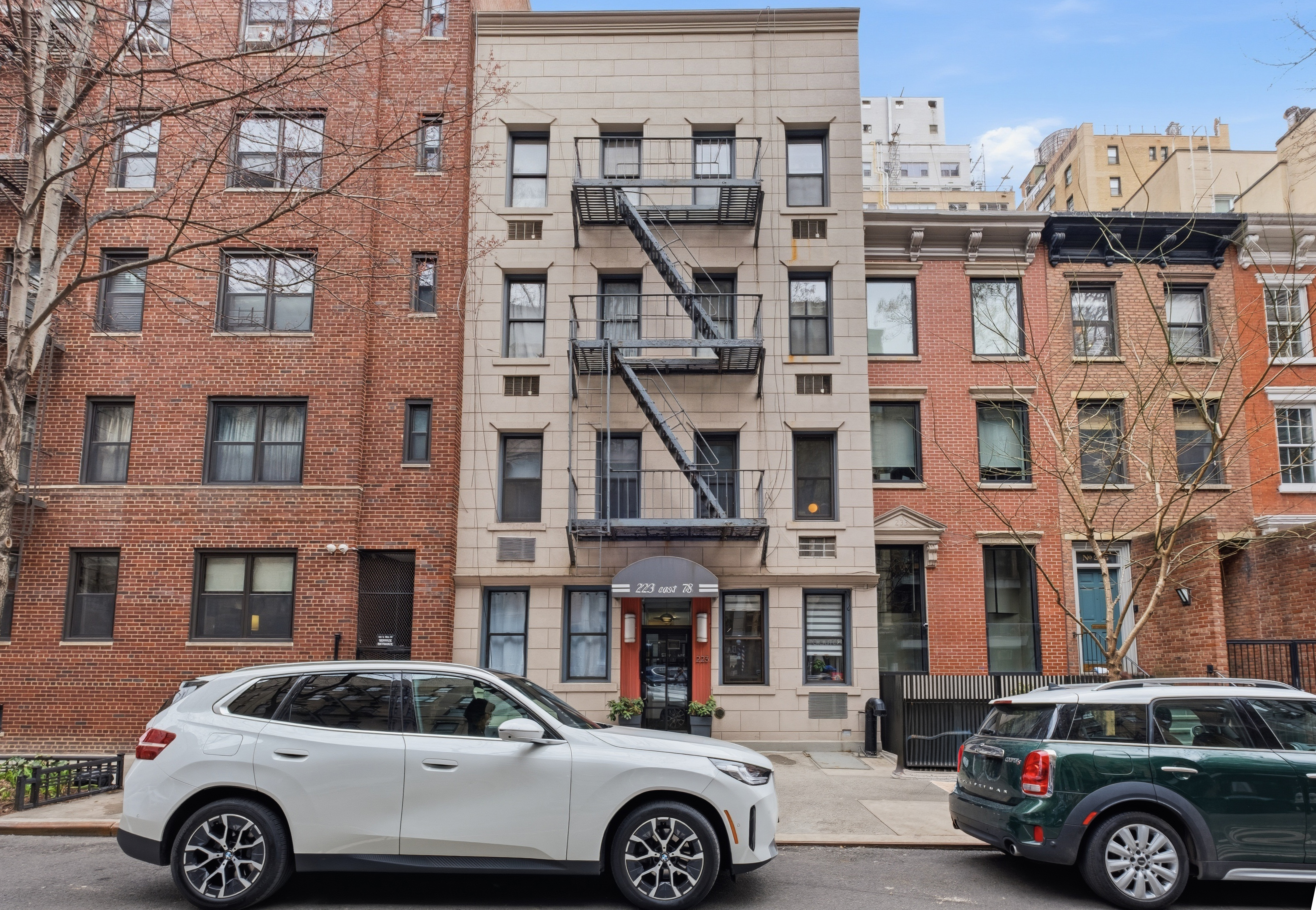 223 East 78th Street, Unit 2B Manhattan, NY 10075 - Photo 5 of 5 a front view of a residential apartment building with a parking space