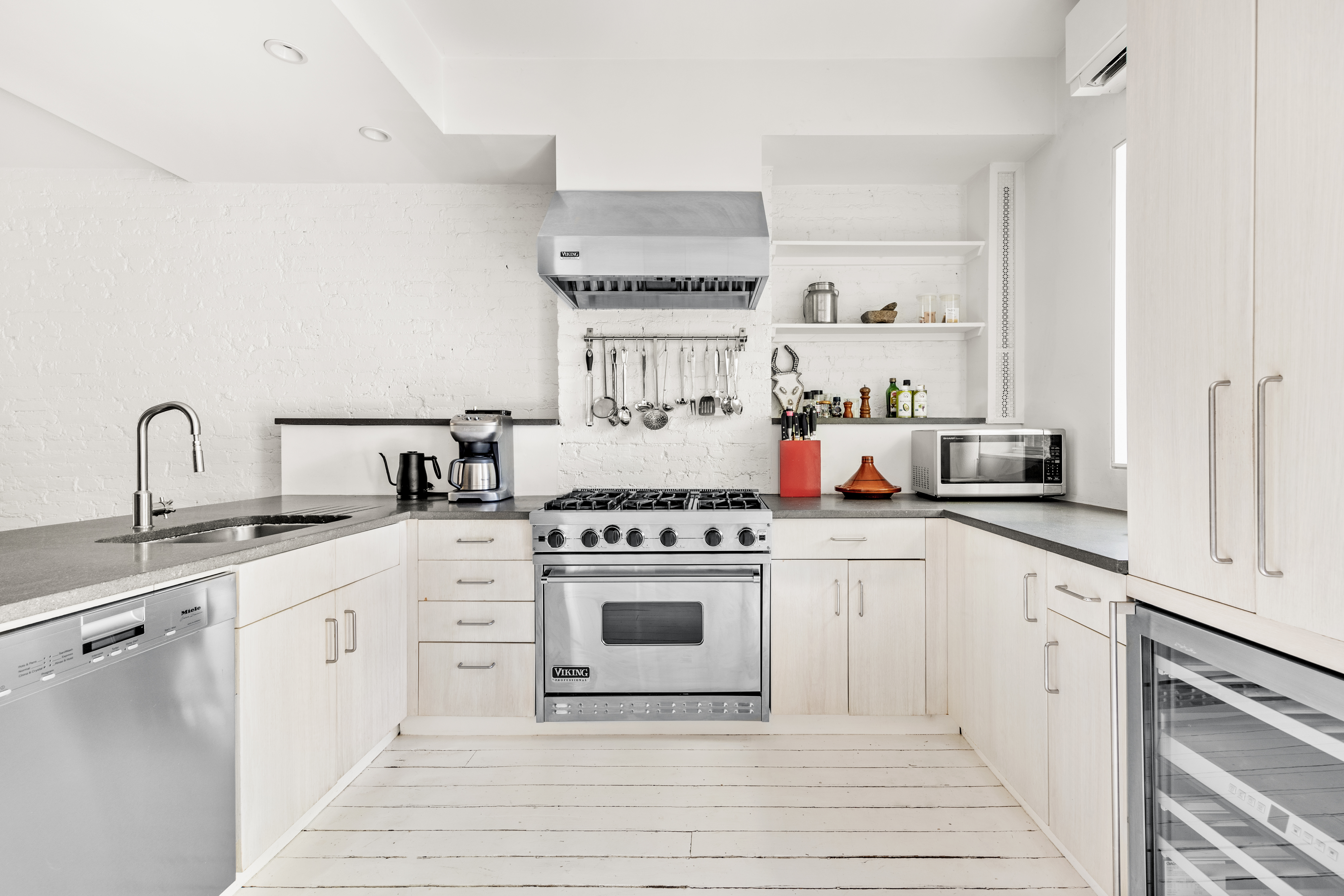 26 A 1st Street Brooklyn, NY 11231 - Photo 6 of 20 a kitchen with cabinets a sink and white appliances