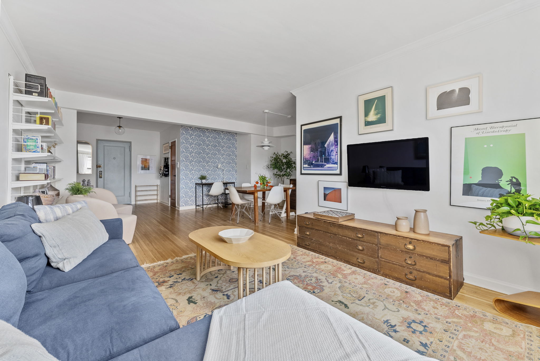 675 Academy Street, Unit 5E Manhattan, NY 10034 - Photo 3 of 10 a living room with furniture and a flat screen tv