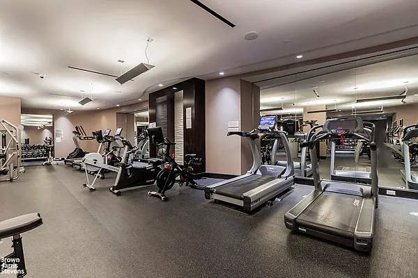 100 Riverside Boulevard, Unit 21A Manhattan, NY 10069 - Photo 12 of 22 a view of a room with gym equipment