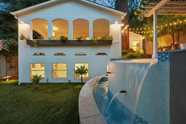 a backyard of a house with seating space