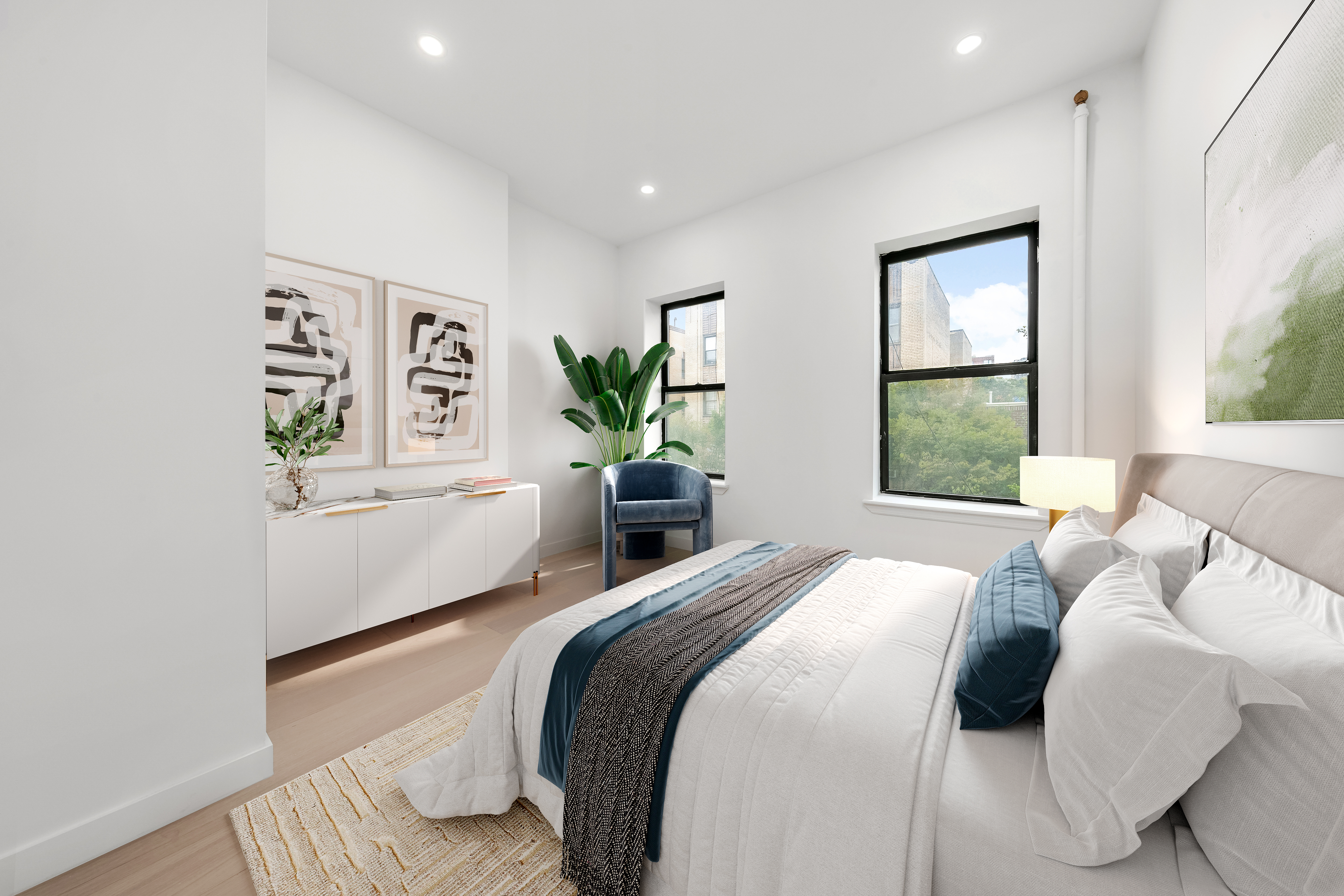 177 East 3rd Street, Unit 2A Manhattan, NY 10009 - Photo 4 of 8 a bedroom with a large bed and a window