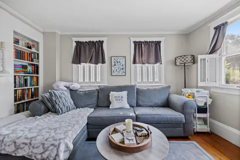 a living room with furniture and a rug