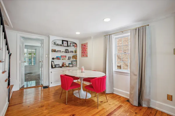 a view of a dining room with furniture window and wooden floor