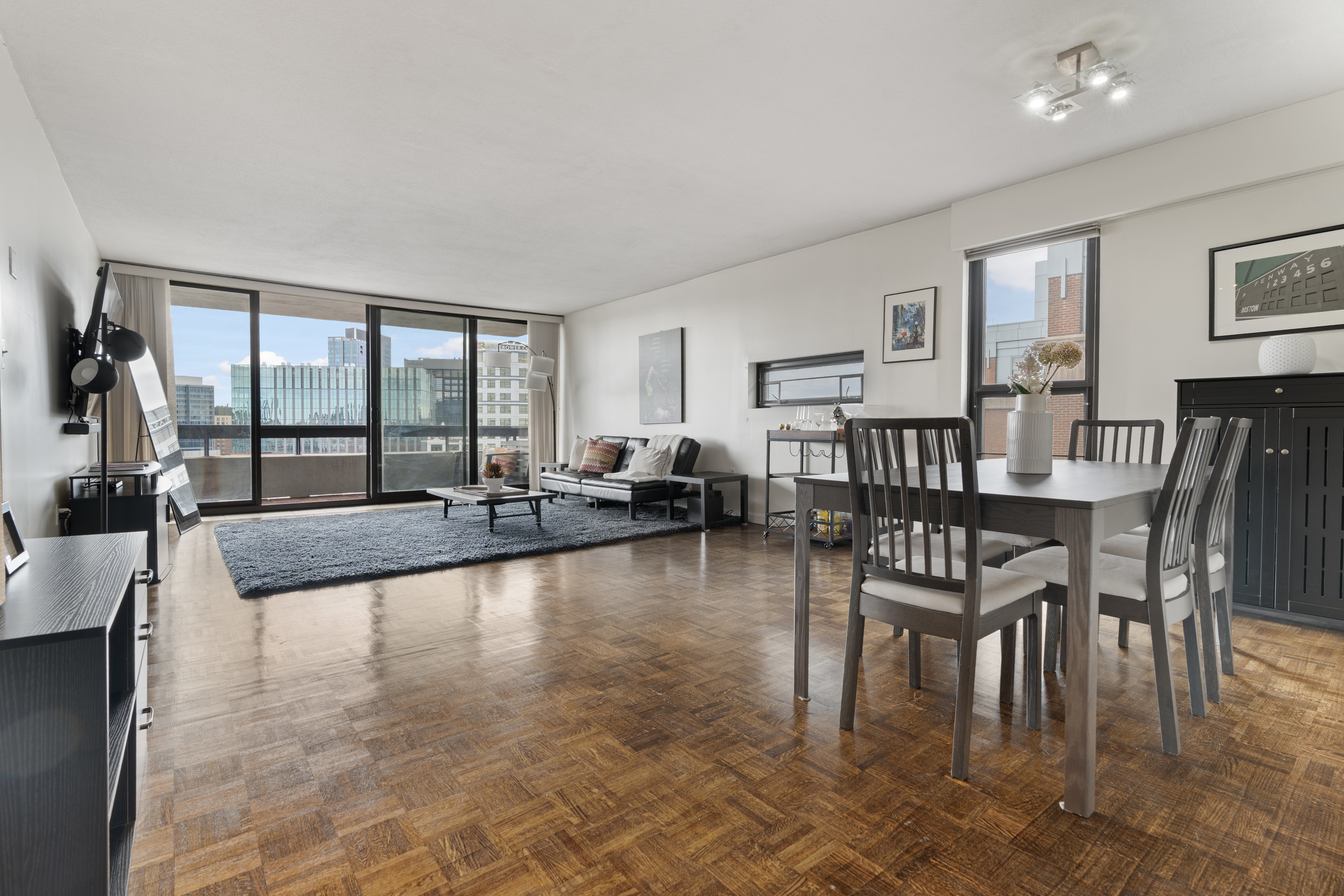 566 Commonwealth Avenue, Unit 1100 Boston, MA 02215 - Photo 2 of 13 a living room with fireplace furniture and a large window