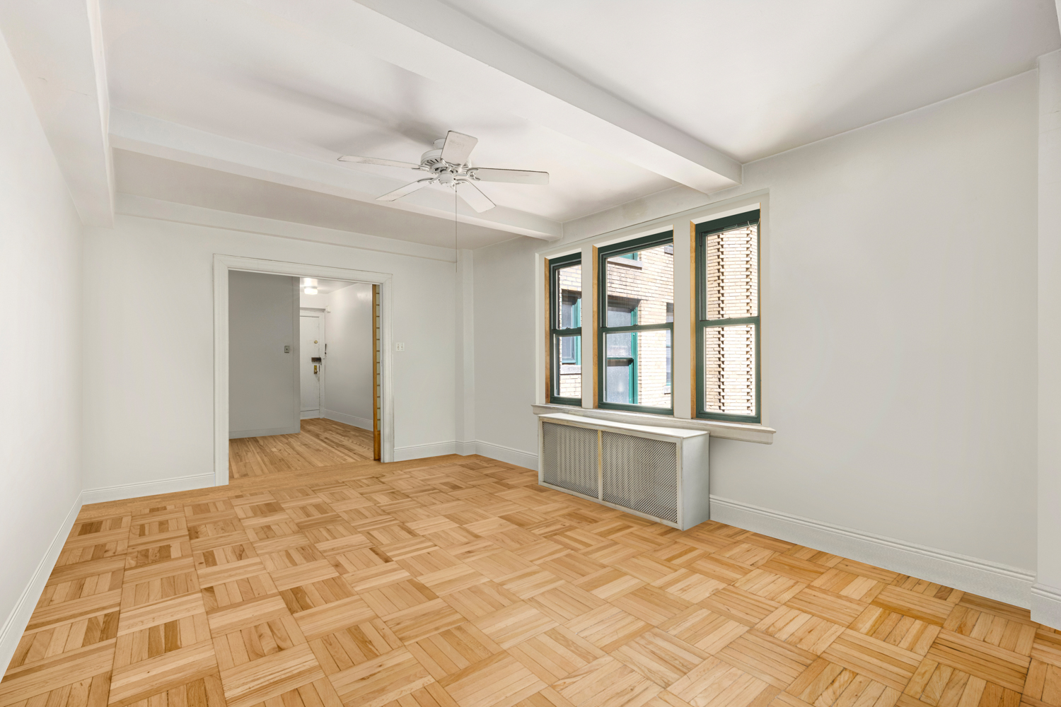 65 West 95th Street, Unit 8C Manhattan, NY 10025 - Photo 5 of 15 a bedroom with a large bed and a window