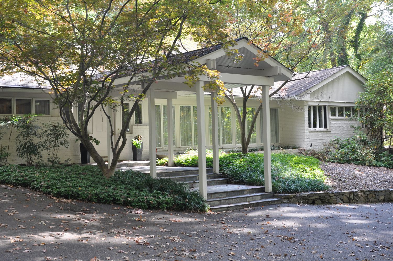 a front view of a house with garden