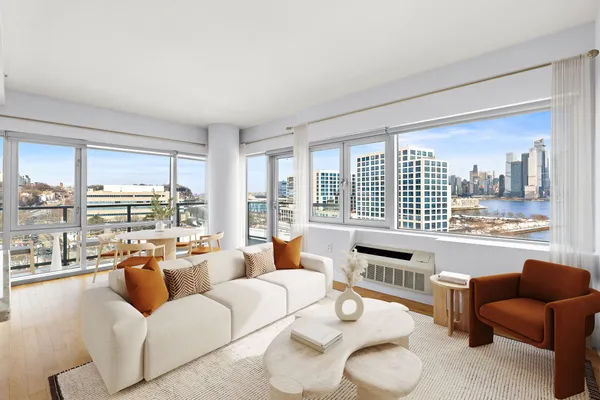 a living room with furniture and a large window