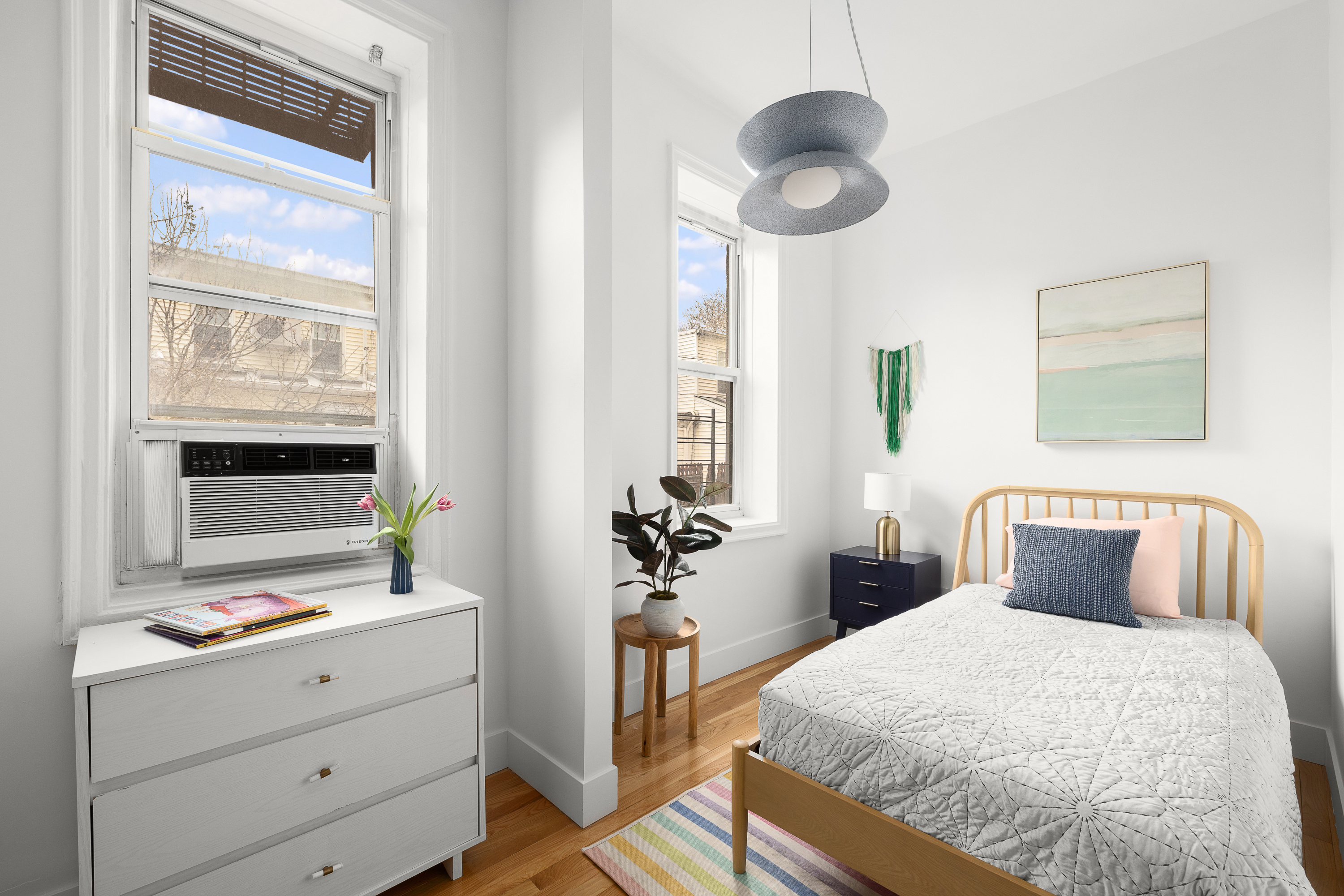 135 Prospect Park Southwest, Unit A6 Brooklyn, NY 11218 - Photo 5 of 10 a bedroom with a bed and a window