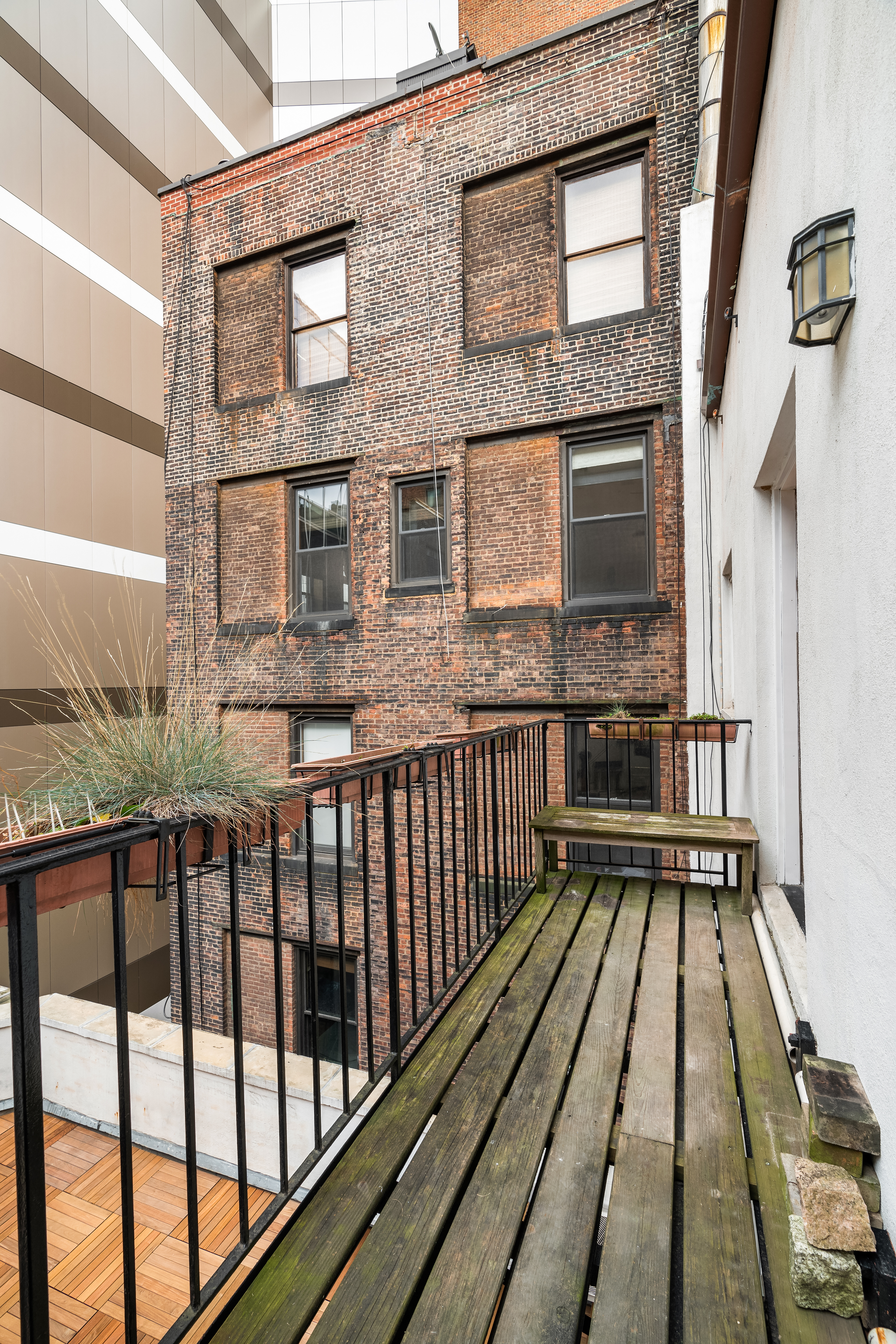 51 East 10th Street, Unit 9 Manhattan, NY 10003 - Photo 8 of 9 a view of a brick building from a balcony
