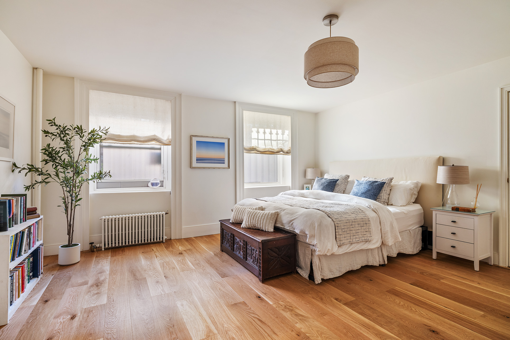417 Clinton Street, Unit 1 Brooklyn, NY 11231 - Photo 10 of 18 a spacious bedroom with a bed and a dresser