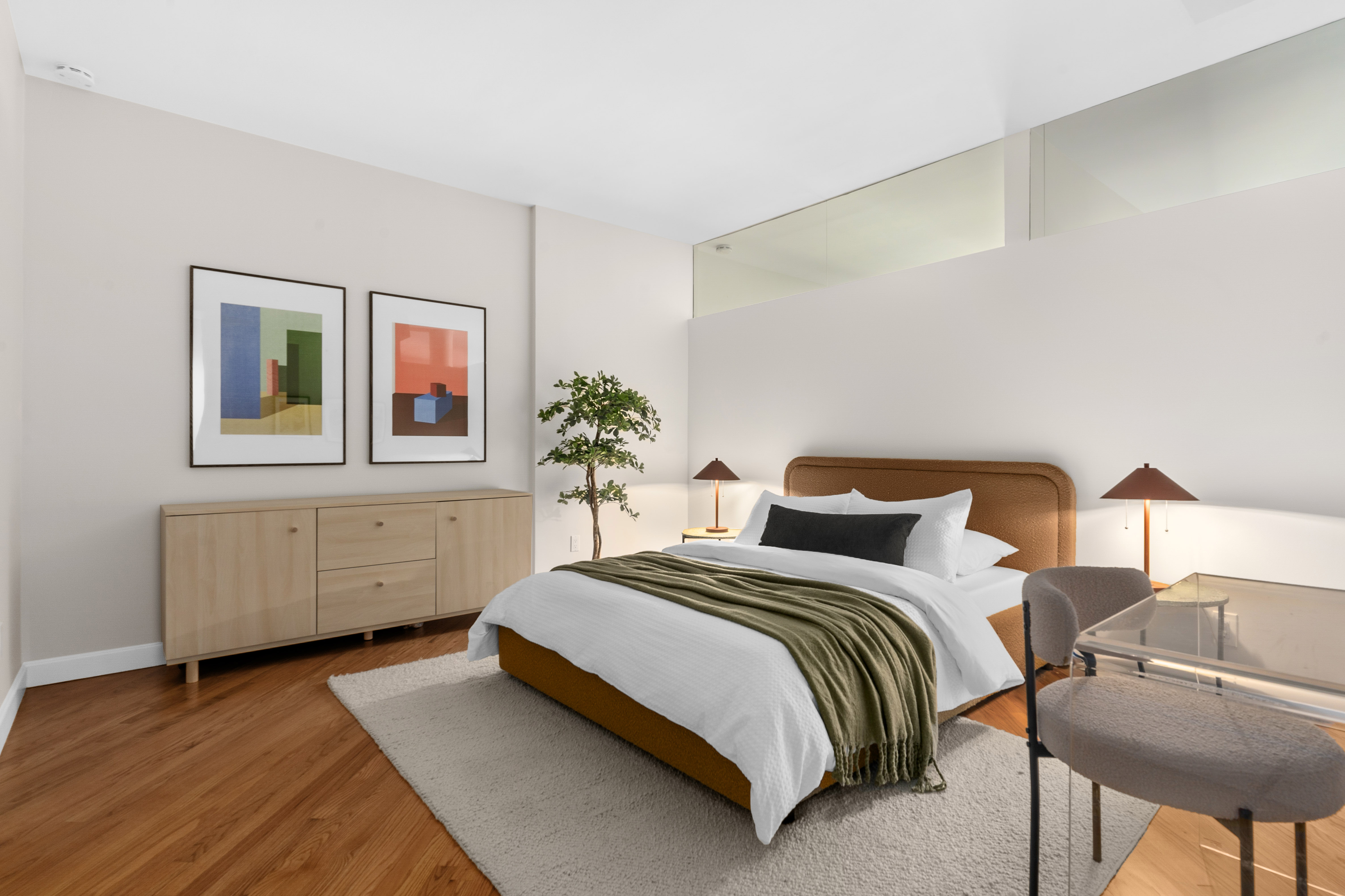 27 East 22nd Street, Unit F4 Manhattan, NY 10010 - Photo 10 of 15 a bedroom with a bed and a table