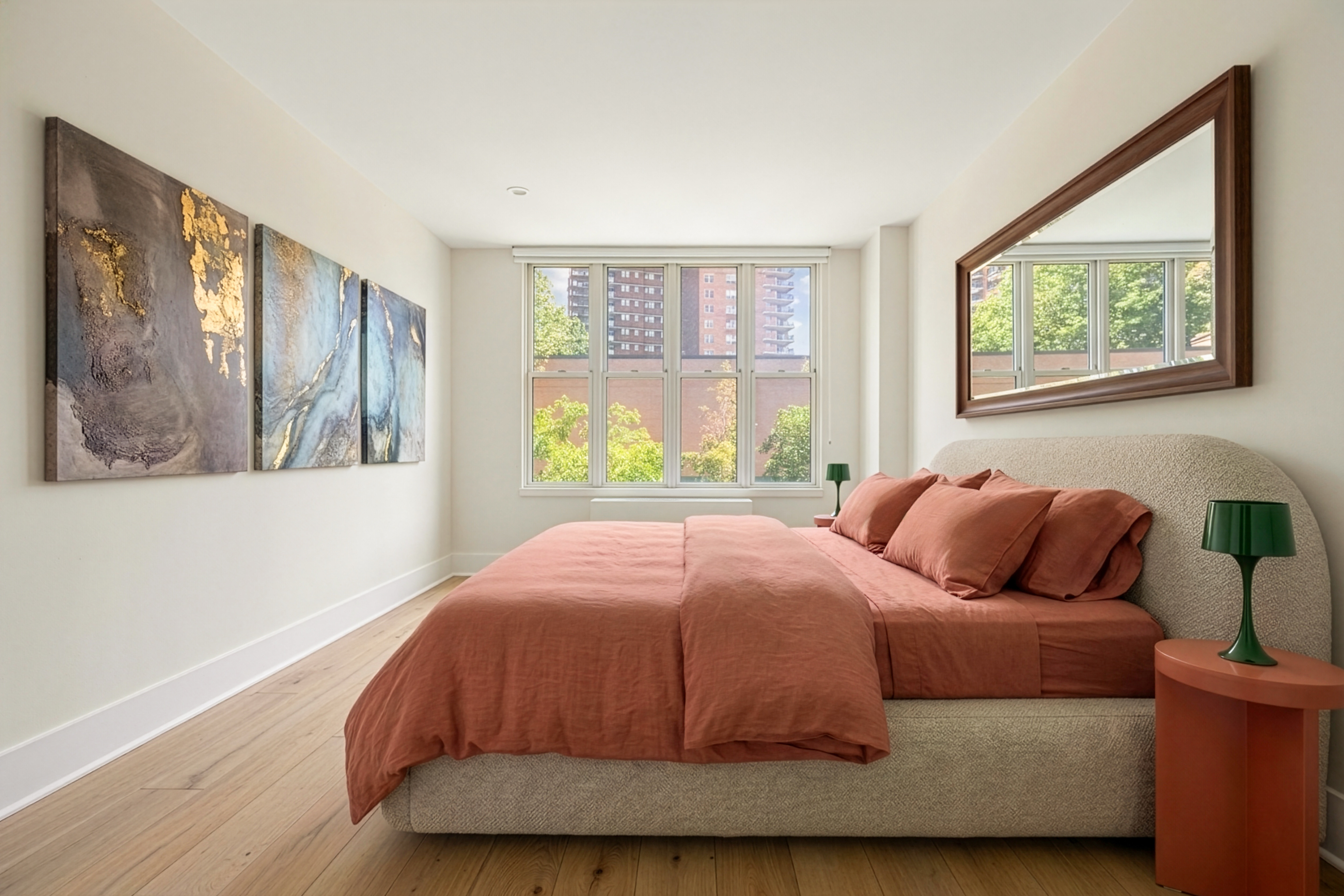 344 West 23rd Street, Unit 2B Manhattan, NY 10011 - Photo 5 of 10 a bedroom with a bed and wooden floor